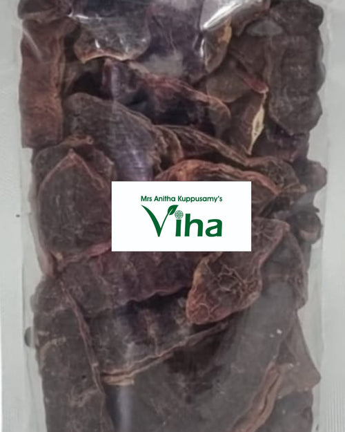 Shikakai Raw / Seeyakkai / Siyakkai, a clear plastic pouch filled with numerous dark brown, dried, irregularly shaped botanical pods with wrinkled surfaces