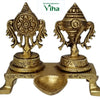 Sangu chakra manai deepam, two engraved pedestals on a footed plinth with a leaf-shaped oil bowl in front