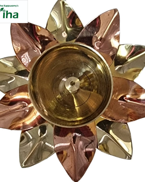 Lotus athma vilakku, alternating copper and brass petals radiating around a domed centre