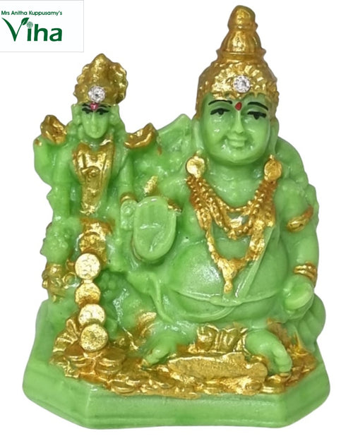 Lakshmi Kuberar, seated green figure with gold-coloured detail, a smaller standing figure behind and coins at the base