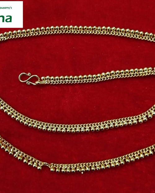 Impon Hip Chain, a gold-toned beaded waist chain with an S-hook clasp on red velvet