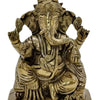 Idampuri Ganesha in brass, seated four-armed figure with the trunk turned to the left