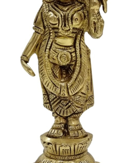 Andal in brass, standing figure on a stepped lotus pedestal with engraved garments and one hand raised