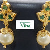 Impon Necklace, two gold-toned drop earrings featuring leaf-shaped posts with three green stones each and a single hanging off-white bead