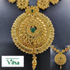 Impon Haram, a gold-toned large teardrop pendant with green stones and textured leaf patterns suspended below a linked necklace with floral motifs