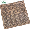 Vyapar Vashya Yantra, a square, gold-toned metallic plate with an etched five-by-five grid containing Tamil script, symbols, and geometric shapes