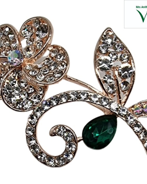 Gold-toned floral saree pin with a green teardrop decoration