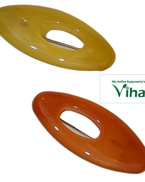 Pair of oval saree pins with centre openings in yellow and orange