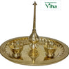 Nalungu Set, tall brass plate with etched patterns on the tray rim, tall central spire with a pointed finial