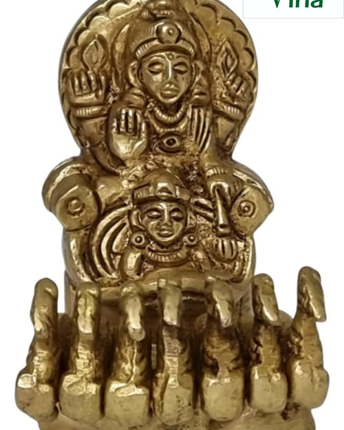 Surya Bhagawan with 7 Horses Chariot, a polished gold-toned figurine featuring two seated human figures and seven aligned animal forms