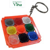 Navagraha Pyramid Key Chain, an orange square holder containing nine colorful pyramid-topped tiles, attached to a silver-toned keyring