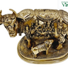 Kamadhenu Cow And Calf - Big, gold-toned metallic cow figurine with a calf and figures on its side on a patterned oval base