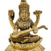 Saraswathi in brass, four-armed figure seated cross-legged on a layered lotus base playing a veena