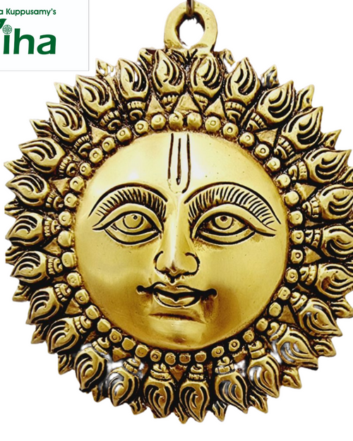Sun Face - Brass, a gold-toned metallic round pendant featuring a human face with incised facial features surrounded by a circular halo of flame-like points