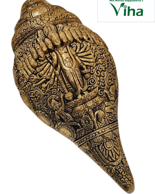 Dasavadhara Metal Sangu, a gold-toned, intricately carved conch-like object with a smooth finish, featuring detailed figural and floral reliefs