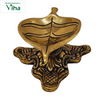 Antique Leaf Lamp Brass, a gold-toned metal leaf-shaped bowl on an ornate, intricately patterned four-legged stand
