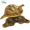 Antique Leaf Lamp Brass, a gold-toned metallic leaf-shaped dish with engraved veins, sitting on an ornate, intricately patterned base