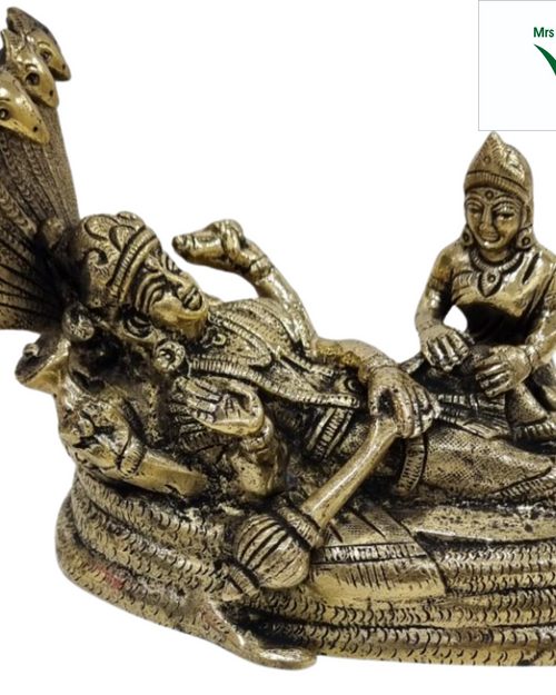 Sri Anantha Padmanaba Perumal in brass, figure reclining along a thickly coiled serpent with the hood raised at the head