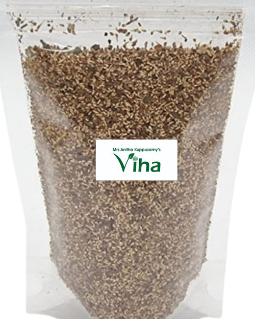 Alam Vithai, a translucent plastic zip-lock pouch filled with fine brown and beige plant particles, featuring a central white label with green text