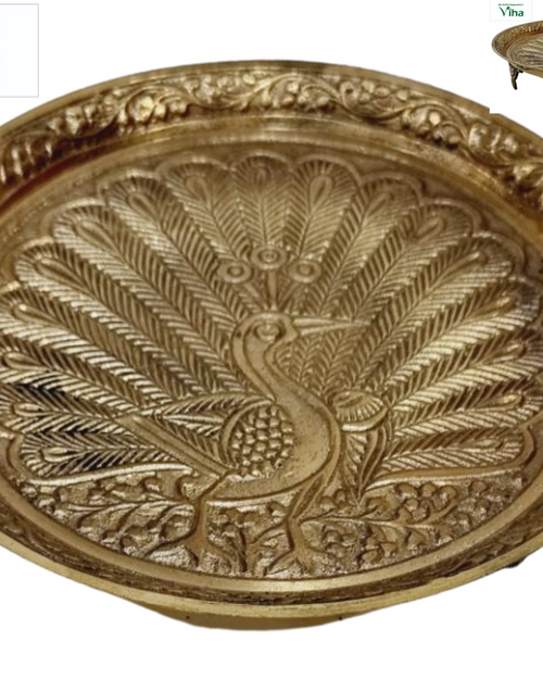 Multi Purpose Peacock Plate with Stand, brass plate with a fanned-tail peacock embossed at the centre and foliage border