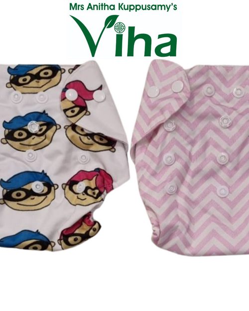 Cloth Diaper for Babies in a white superhero-print piece and a pink chevron-print piece, both with snap closures