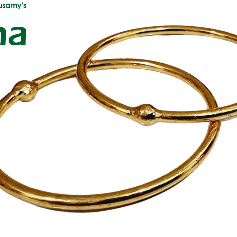 Impon Bangles, two smooth gold-toned round bangles with one small bead each, overlapping diagonally on a white background