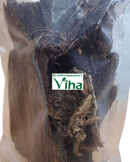 Veppam Pattai, a clear plastic bag filled with dark brown fibrous bark pieces and pale roots, featuring a rectangular green and white label with text