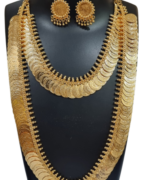 Impon Lakshmi Kasu Malai, a gold-toned jewellery set consisting of two layered coin necklaces and a pair of matching jhumka earrings on a black bust