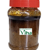 Avarampoo Thokku in a clear glass jar with a red screw lid