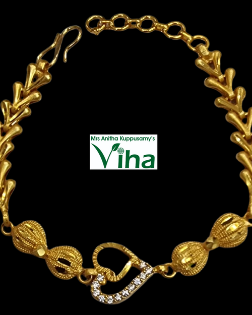 Impon Bracelet, a gold-toned chevron-link bracelet with a heart-shaped stone clasp