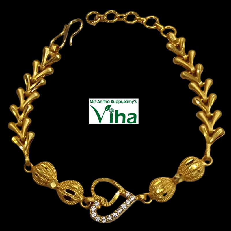 Impon Bracelet, a gold-toned chevron-link bracelet with a heart-shaped stone clasp