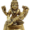 Saraswathi in brass, four-armed figure seated on a square stepped base with a tall crown and arms raised