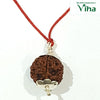 5 Mukhi Rudraksh, a brown bead pendant with silver capping on a red cord