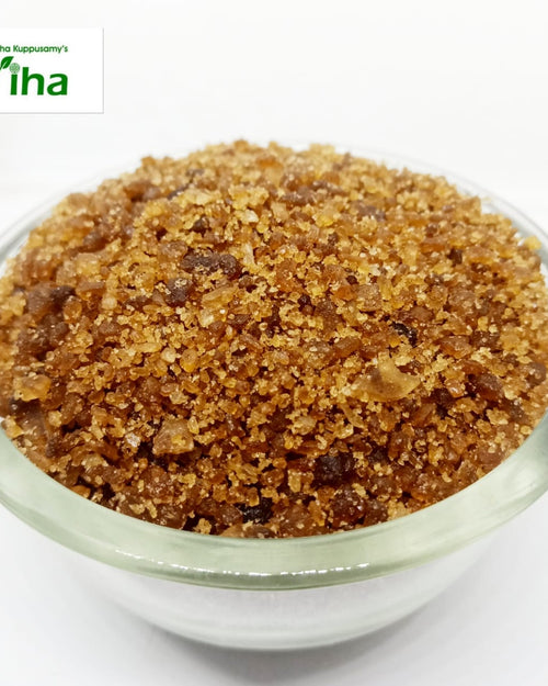 Palm Sugar Crystals (Panangalkandu), a small clear bowl filled with glistening brown crystallized granules of varying sizes
