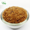 Palm Sugar Crystals (Panangalkandu), a small clear bowl filled with glistening brown crystallized granules of varying sizes