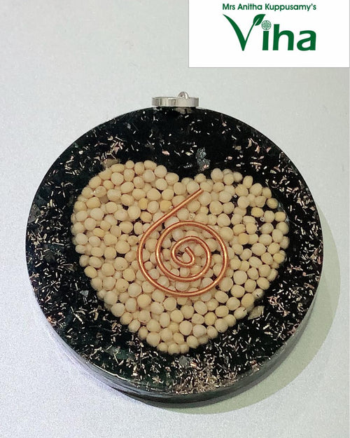 Black Tourmaline & Ven Kadugu Keychain with an embedded wire and beige items
