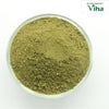 Adathodai Powder / Malabar Nut Powder, an overhead shot of fine greenish powder piled inside a clear round glass bowl on a white surface