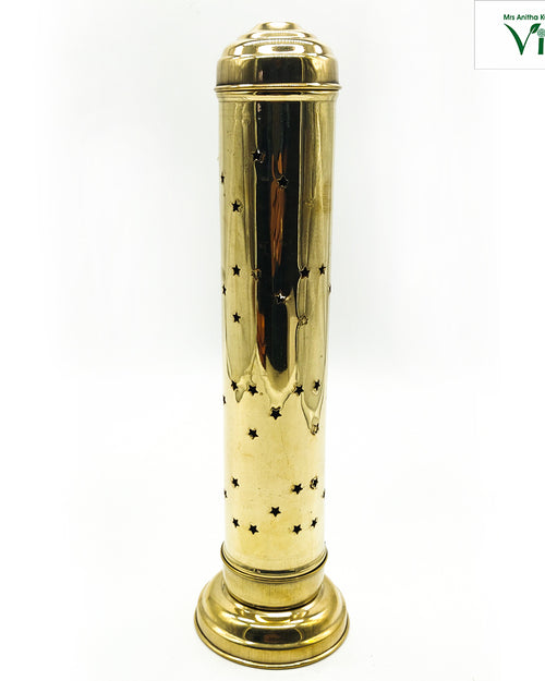 Agarbathi Stand, tall brass cylinder pierced with star-shaped holes, with a domed stepped cap and flared circular foot