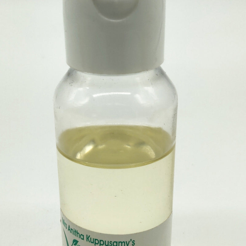 Argan Oil - Organic, a clear bottle filled with yellow liquid, topped with a white flip-top cap, features a label at the bottom with green and black text