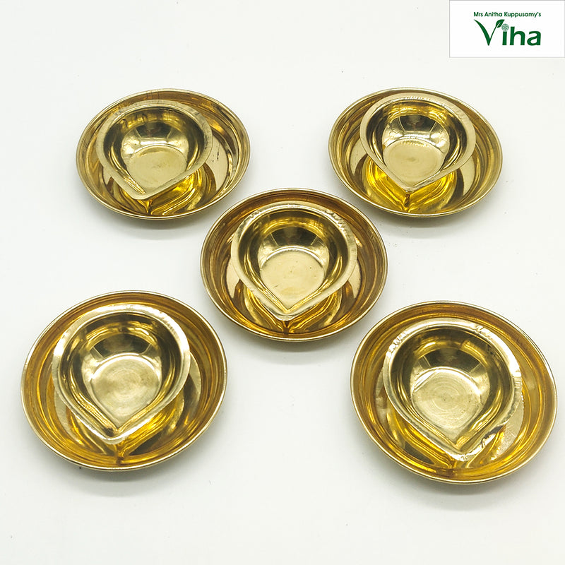 Brahma muhurtha vilakku set of five, teardrop brass oil cups each seated in a round brass dish