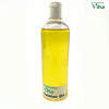 Castor Oil, a tall clear plastic bottle filled with yellow liquid, featuring a white flip-top cap and a white label near the base