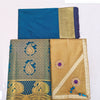 Apoorva Silk Half Saree Set, folded blue fabric, blue fabric with gold-toned motifs, and gold-toned fabric with two purple flowers