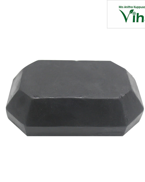 Charcoal Soap - Handmade, a dark grey faceted block with a flat top and slanted sides forming an octagonal shape