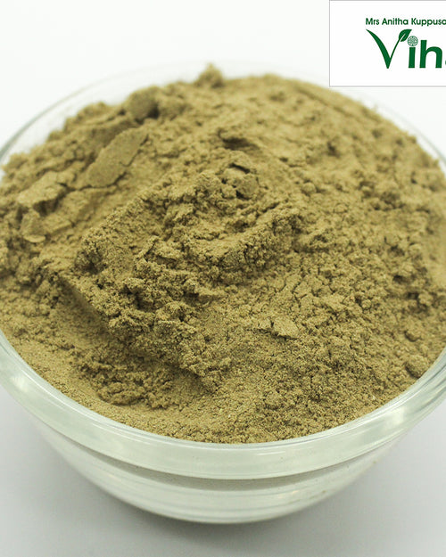 Children Herbal Bath Powder, a clear glass bowl filled with finely ground olive-green powder