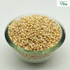 Jowar (sorghum) grains piled in a clear glass bowl
