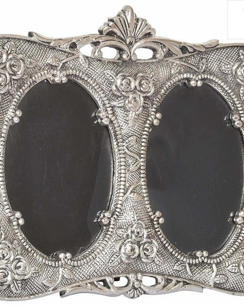Antique White Metal Dual Photo Frame, a silver-toned double oval frame with embossed floral motifs, textured background, and ornate crest