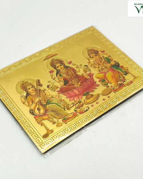 Ganesha, Saraswathi, Mahalakshmi / Magnetic Photo, a gold-toned rectangular embossed plaque depicting three figures amidst borders with Greek key motifs