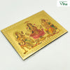 Ganesha, Saraswathi, Mahalakshmi / Magnetic Photo, a gold-toned rectangular embossed plaque depicting three figures amidst borders with Greek key motifs