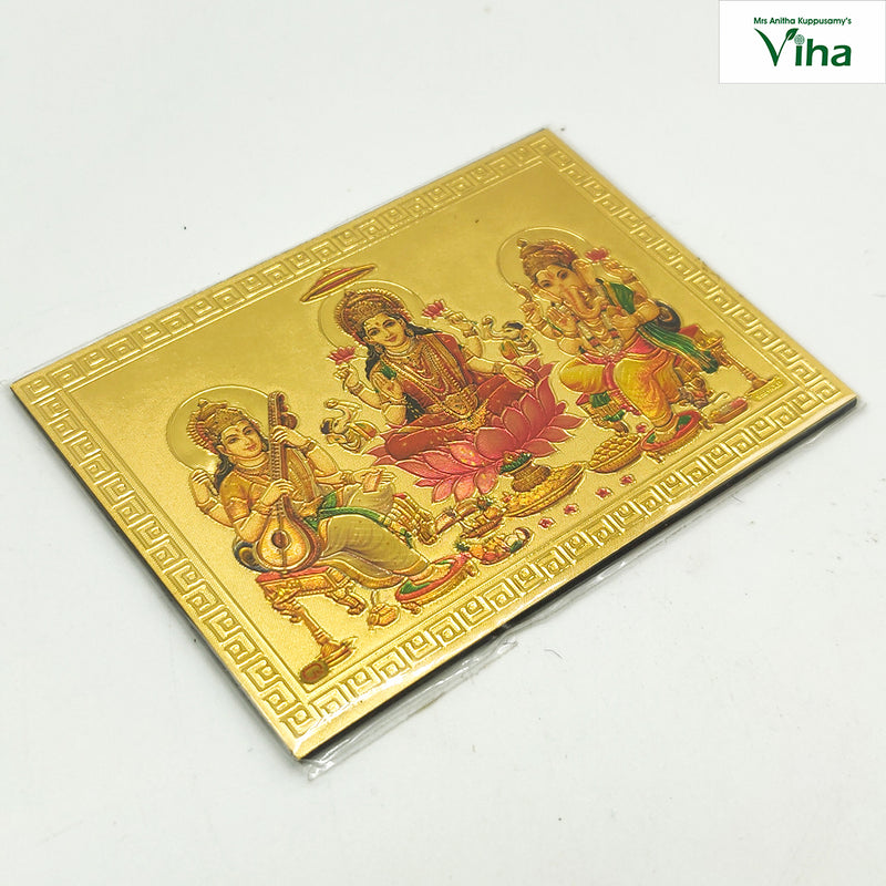 Ganesha, Saraswathi, Mahalakshmi / Magnetic Photo, a gold-toned rectangular embossed plaque depicting three figures amidst borders with Greek key motifs