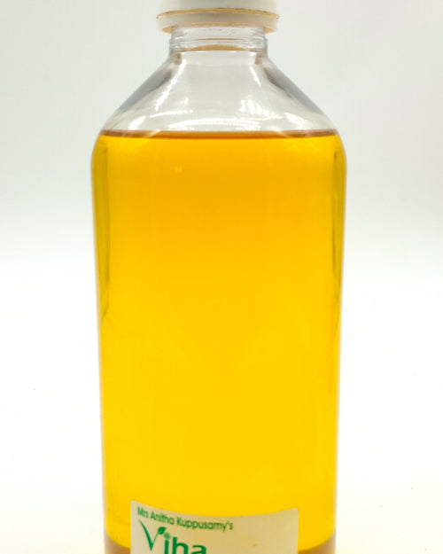 Gingelly Oil, a clear plastic bottle of yellow oil with a white ribbed cap and a label near the bottom